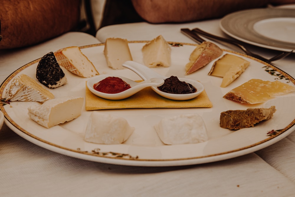 a white plate topped with lots of different types of cheese