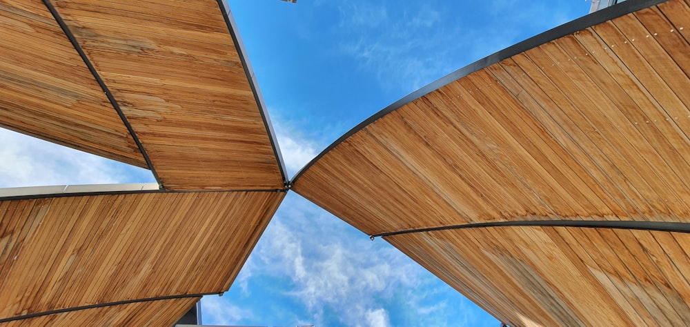brown wooden roof under blue sky during daytime
