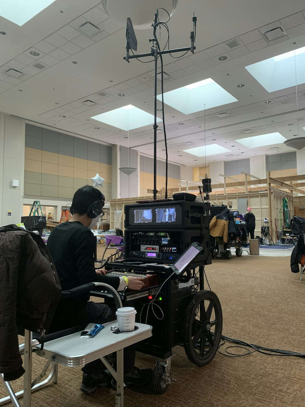 a person sitting in a wheel chair in a room