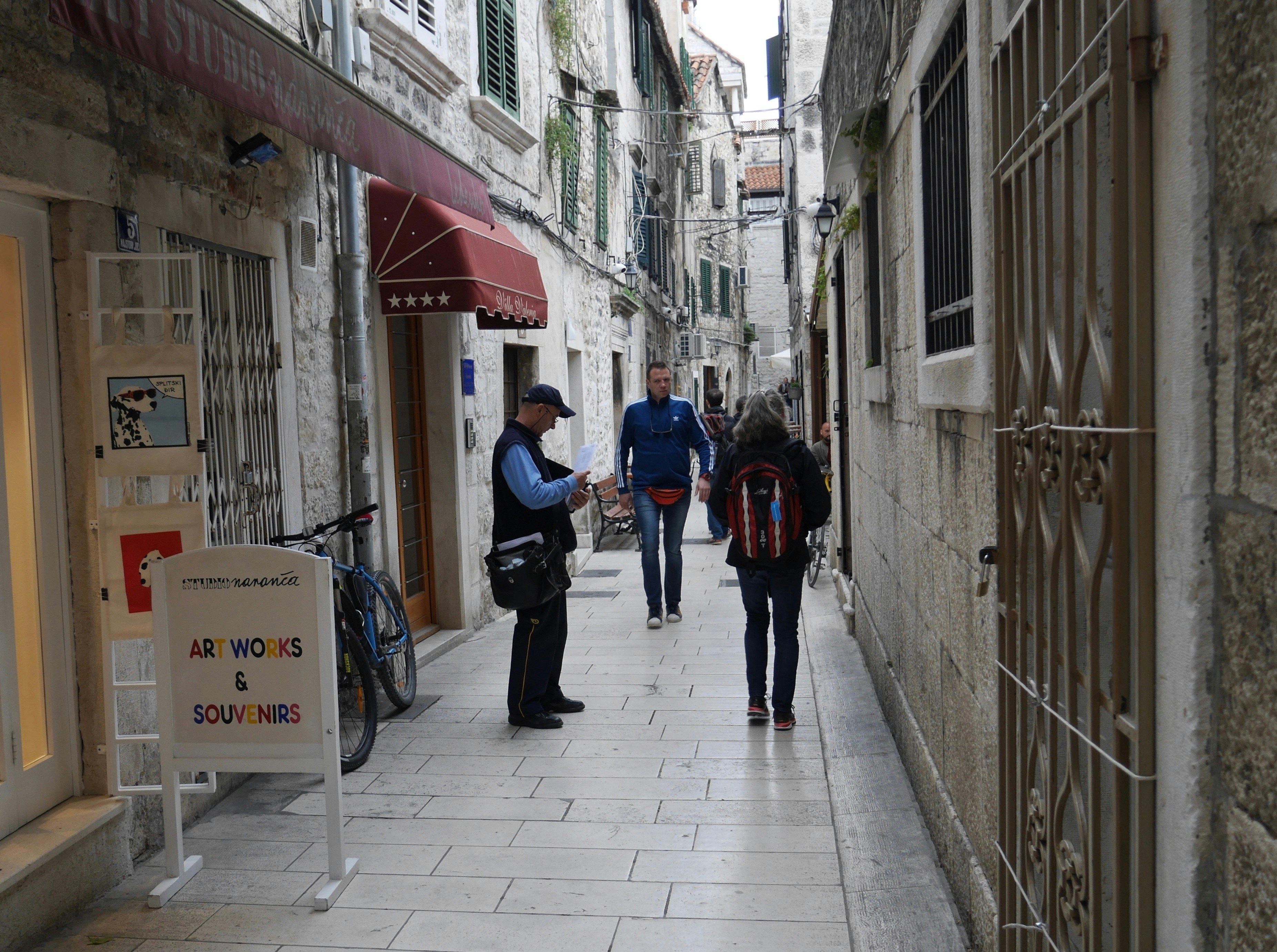 people walking on sidewalk during daytime