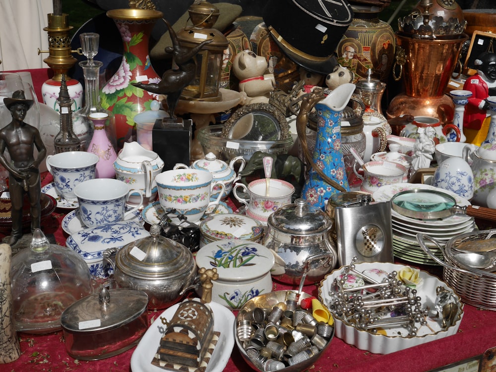 assorted ceramic mugs on stainless steel rack