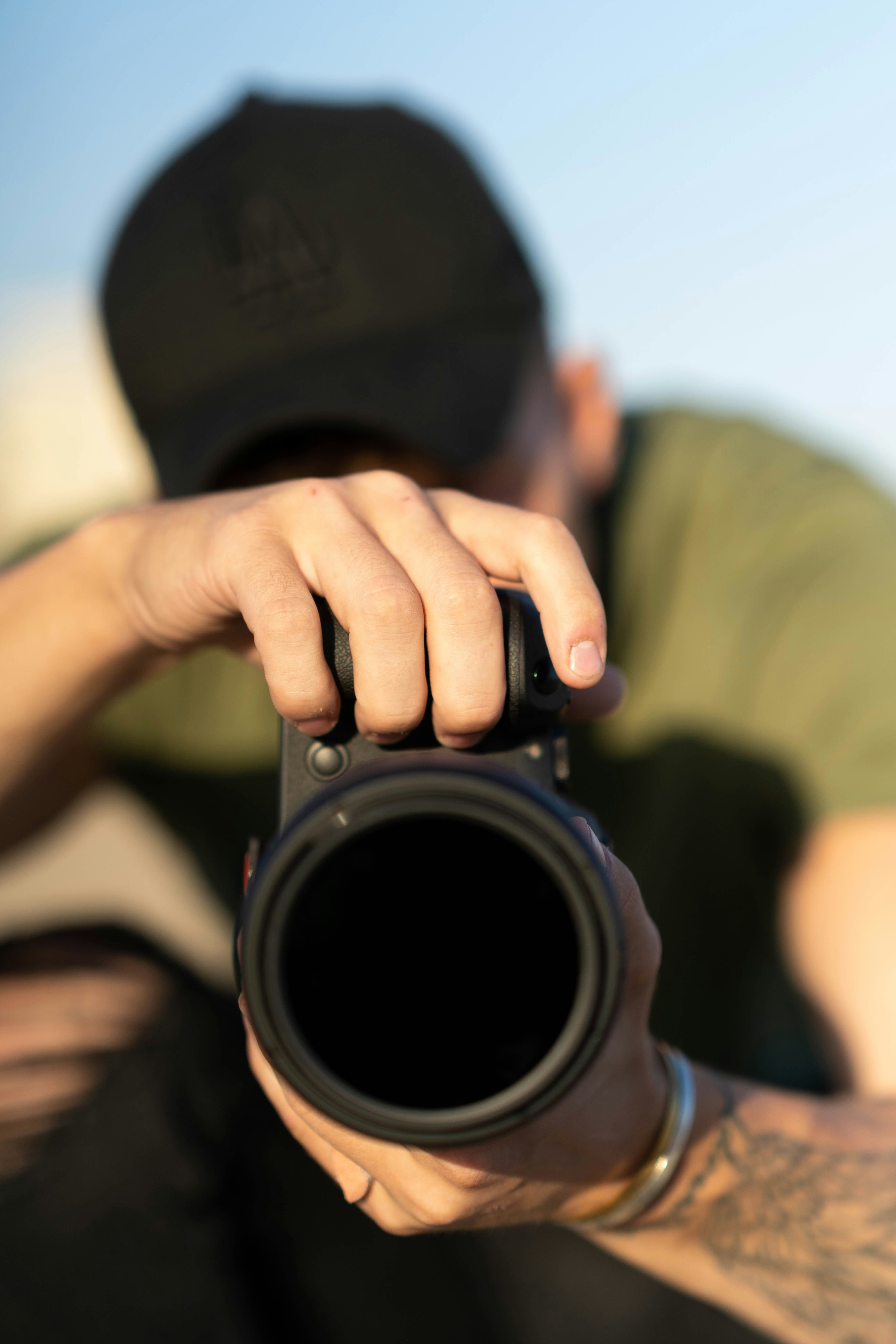 person holding black dslr camera