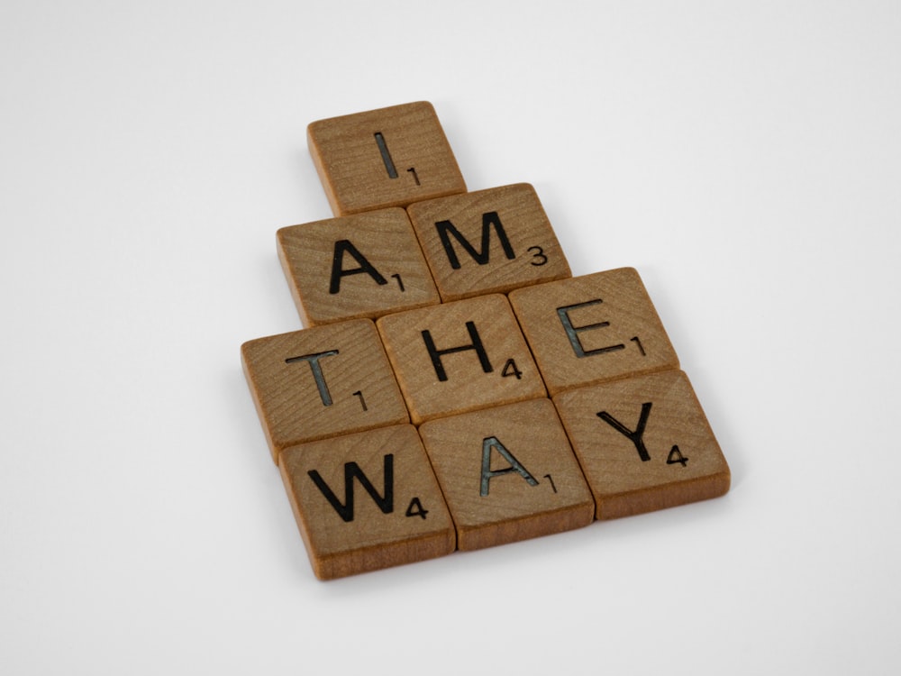 a scrabbled piece of wood that says i am the way