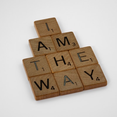 a scrabbled piece of wood that says i am the way