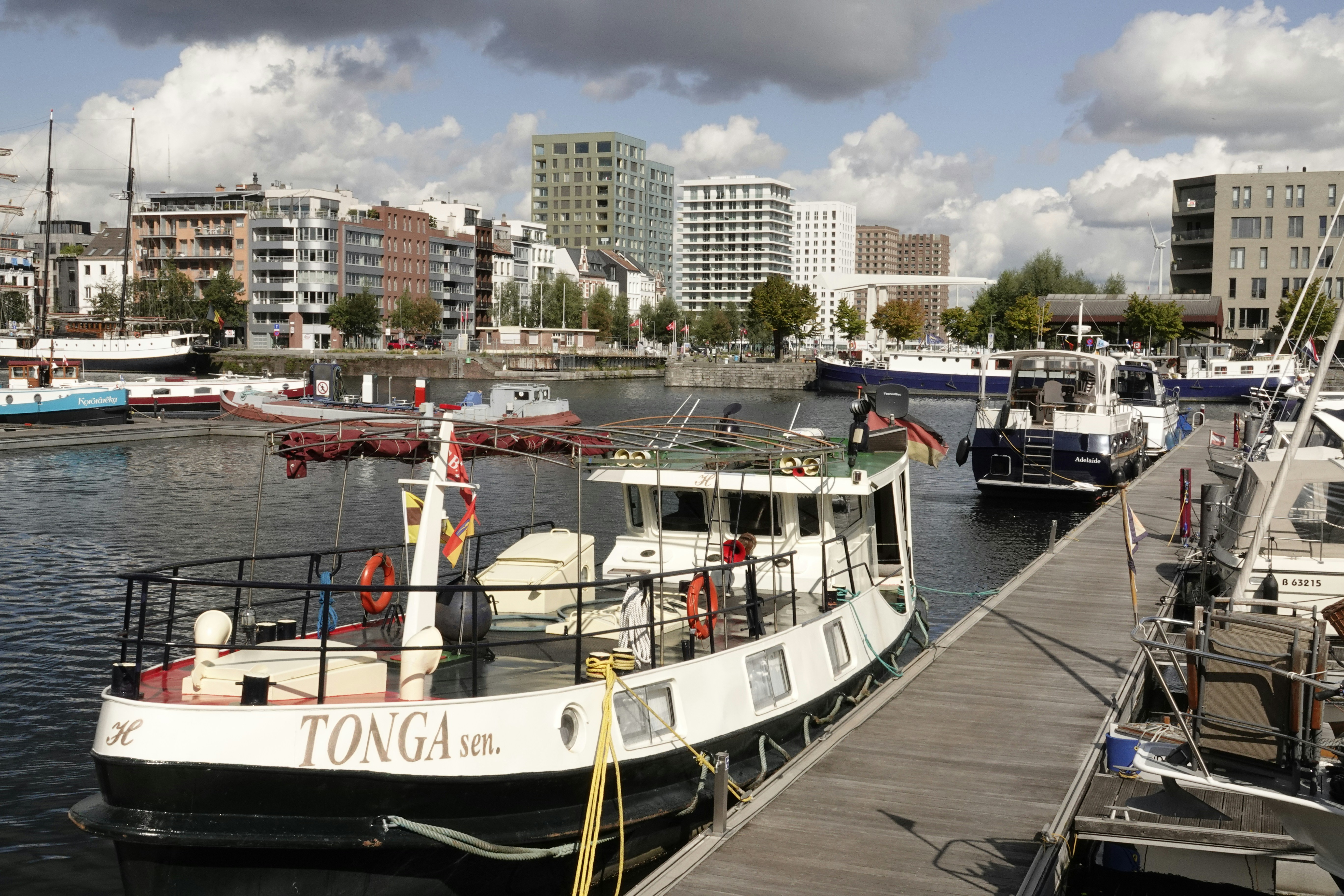 white and black boat on dock during daytime