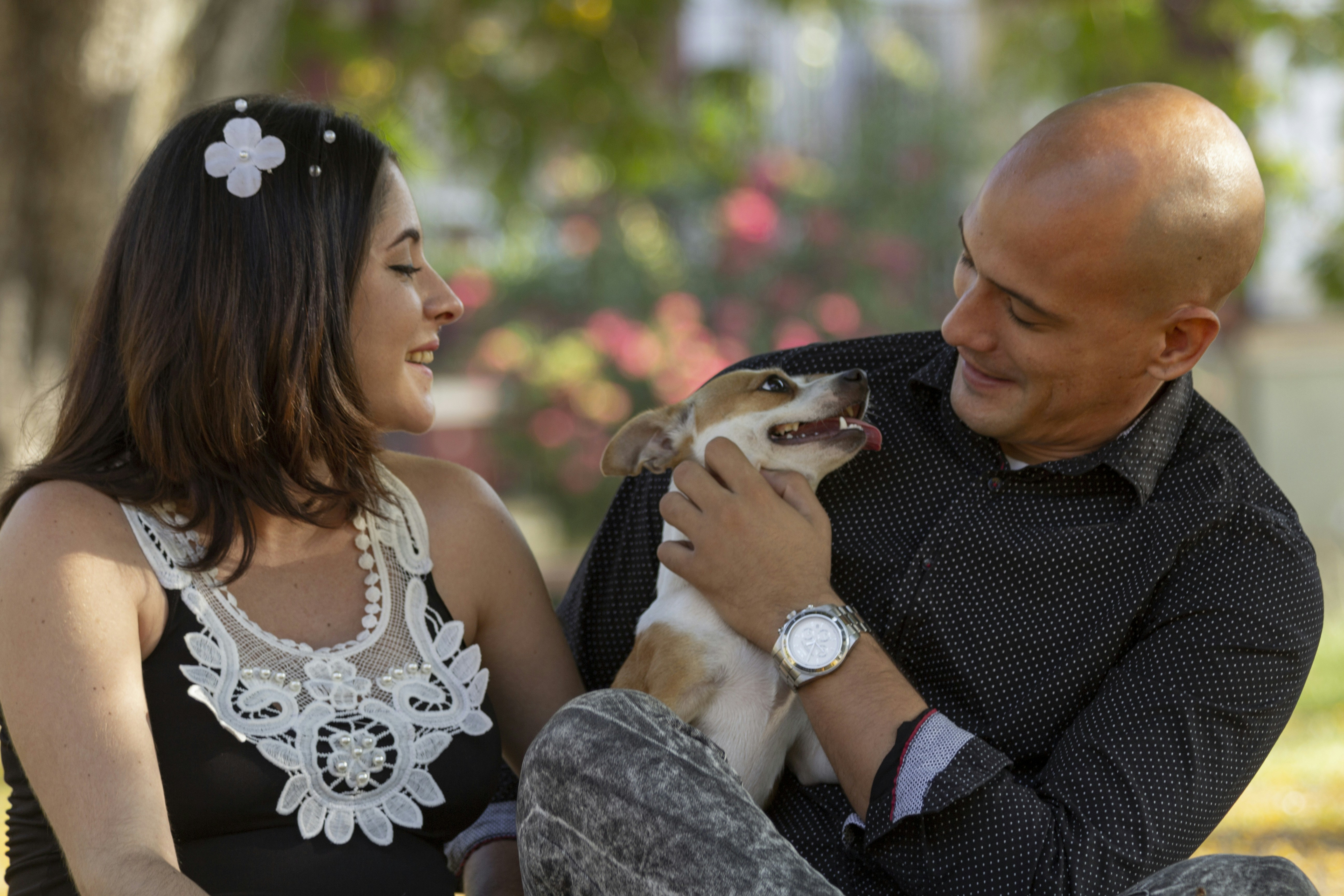 Bride reads vows to groom at outdoor wedding.