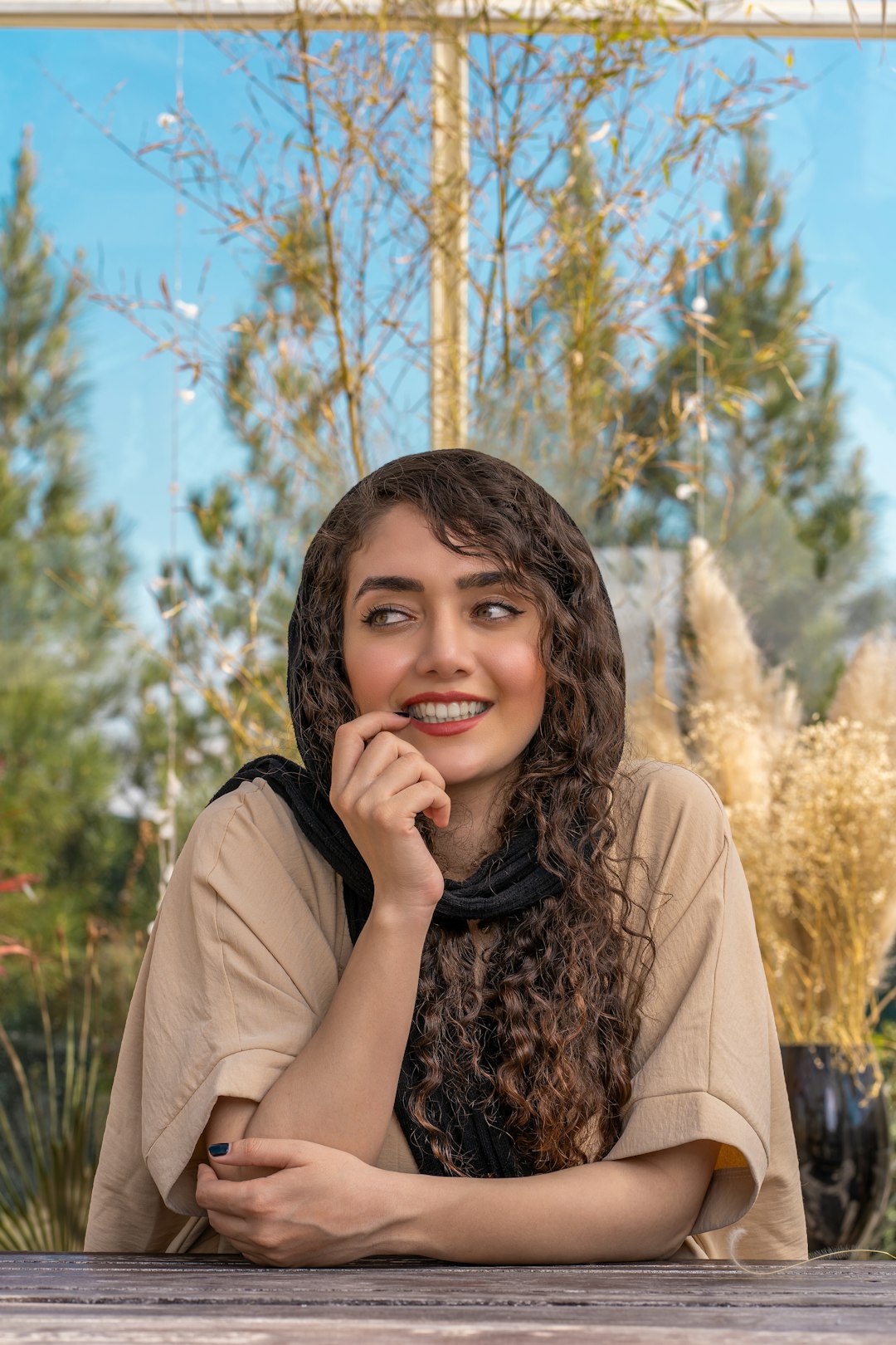 woman in brown coat smiling