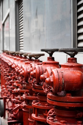 red metal pipe lot during daytime
