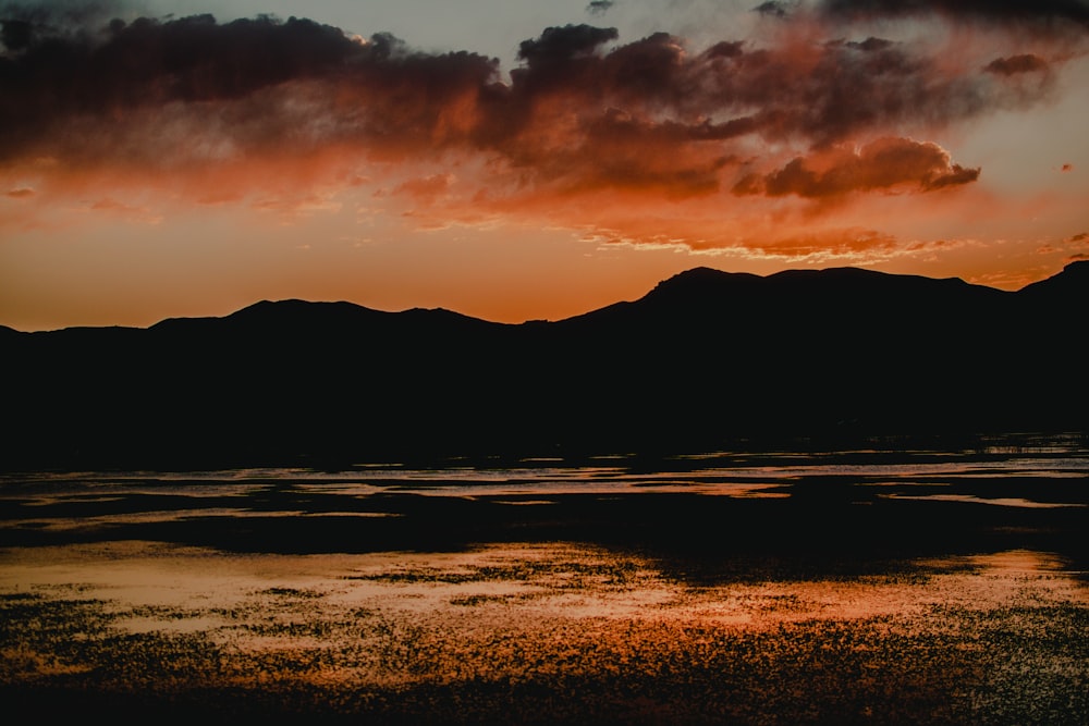 silhouette of mountain during sunset