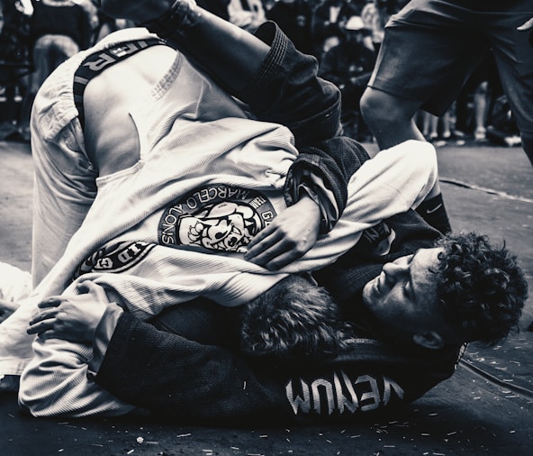 a man on the ground in a black and white photo