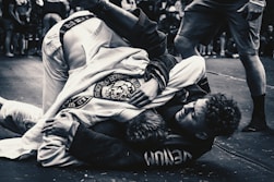 a man on the ground in a black and white photo