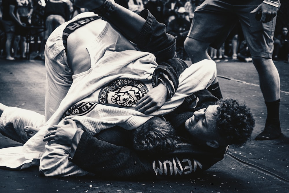 a man on the ground in a black and white photo