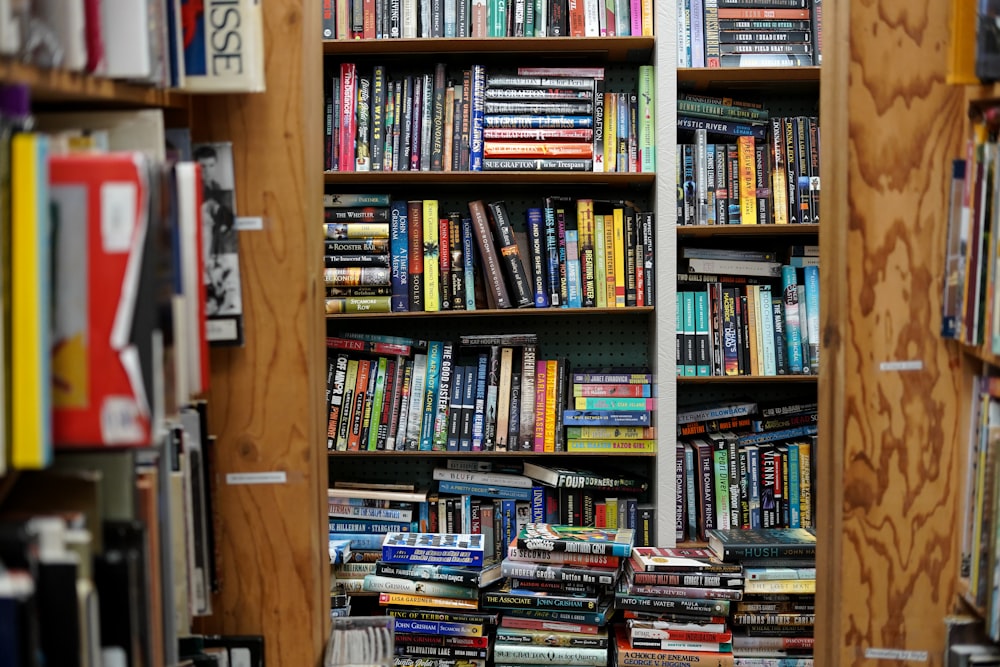 books on brown wooden shelf