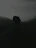 A moody, atmospheric illustration of a young man standing at the edge of a shadowy forest, hinting at a hidden vampire society.