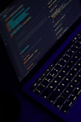 black laptop computer turned on showing microsoft word