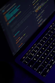 black laptop computer turned on showing microsoft word