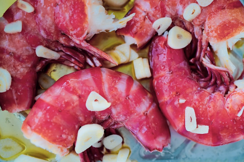 a close up of a plate of food with lobsters