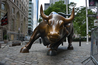 brown and black cow statue on gray brick floor