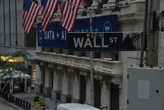 a street sign on wall street in new york city