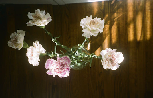 a bunch of flowers that are in a vase