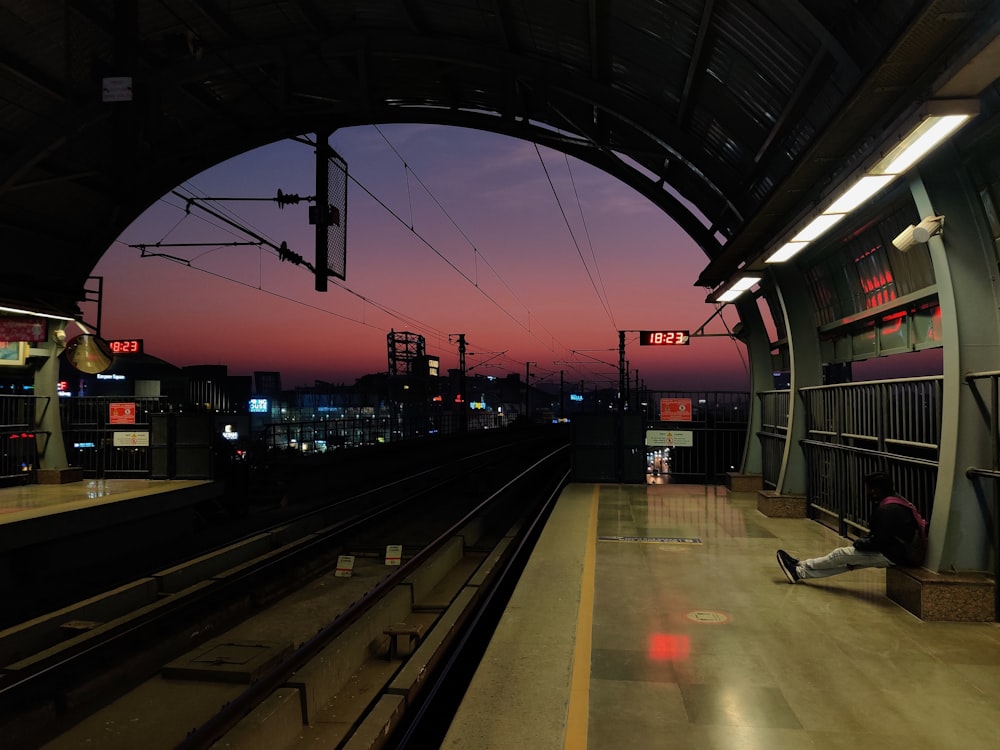 train station with red light during night time