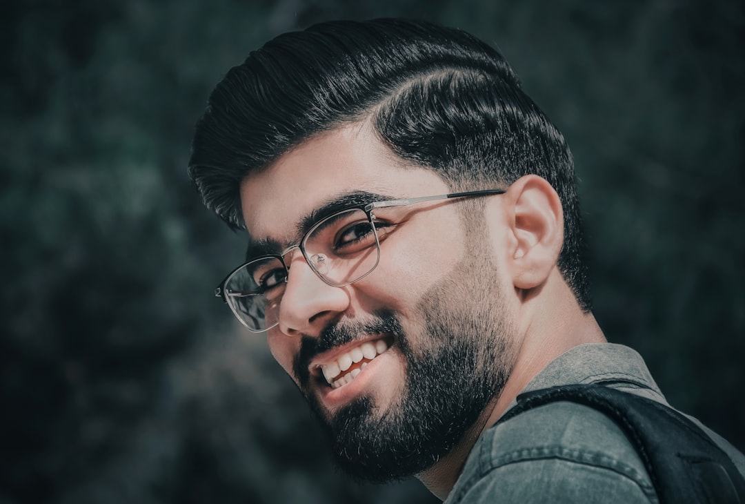 man in black framed eyeglasses