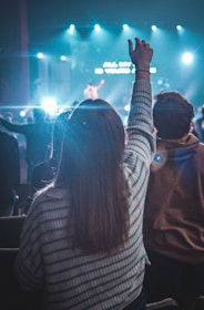 a group of people standing in front of a stage