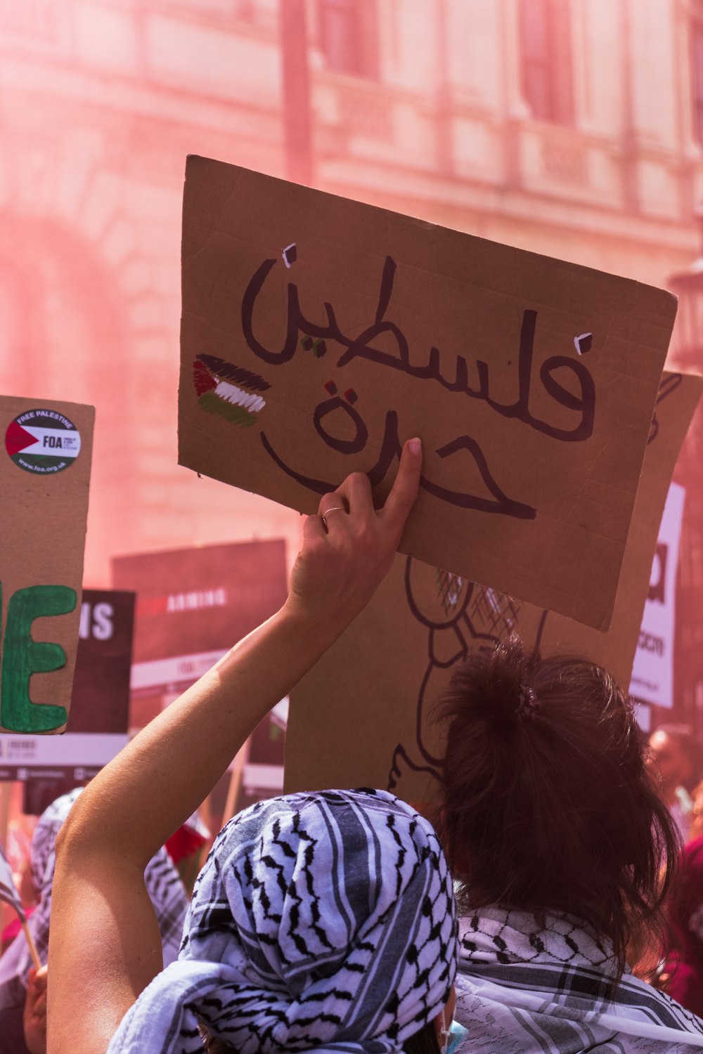 a group of people holding up signs in the air