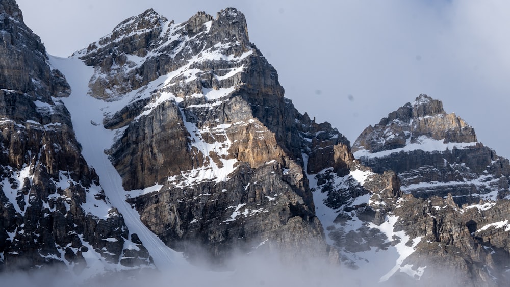 snow covered mountain during daytime