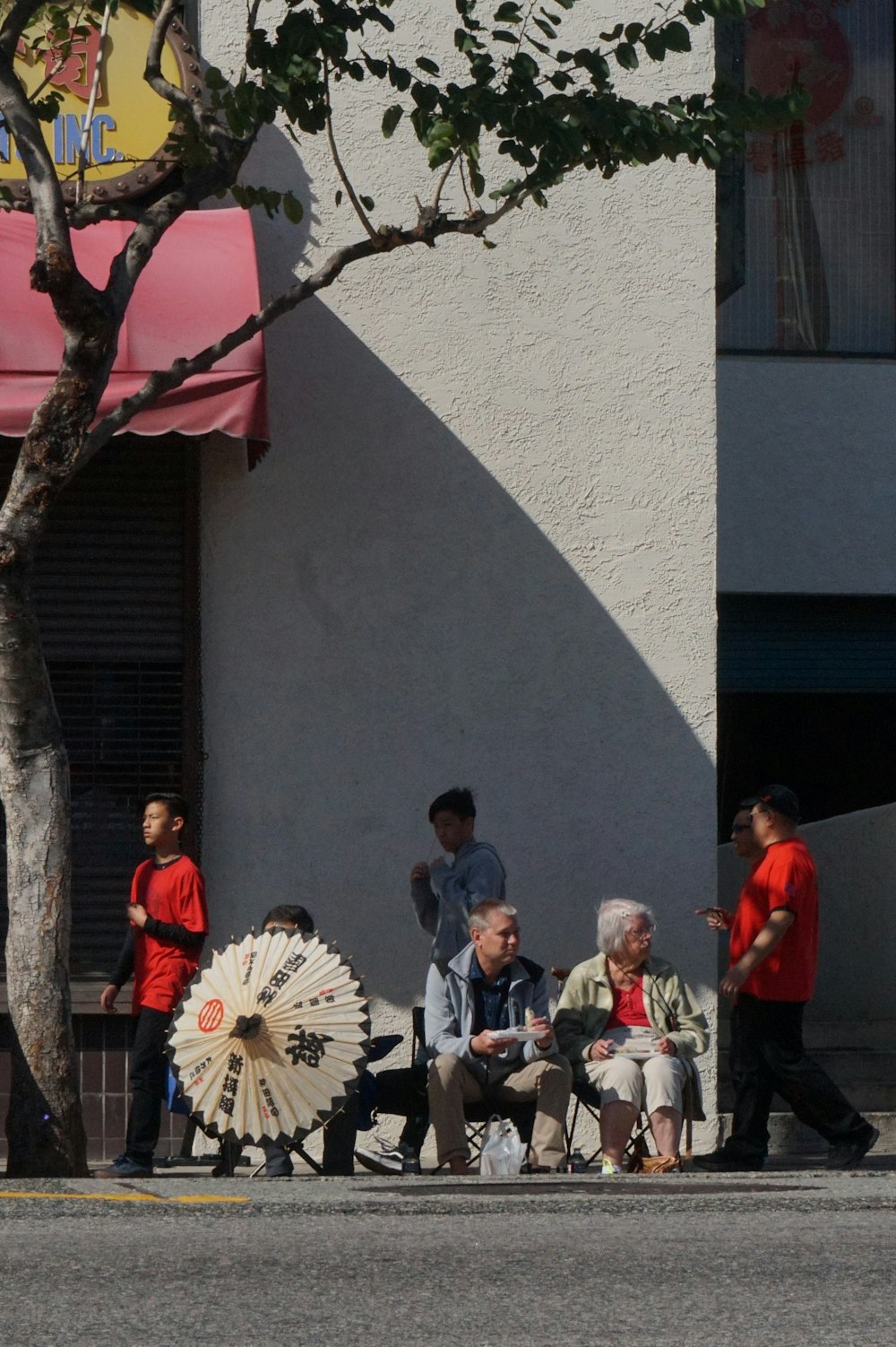 people standing near white concrete building during daytime