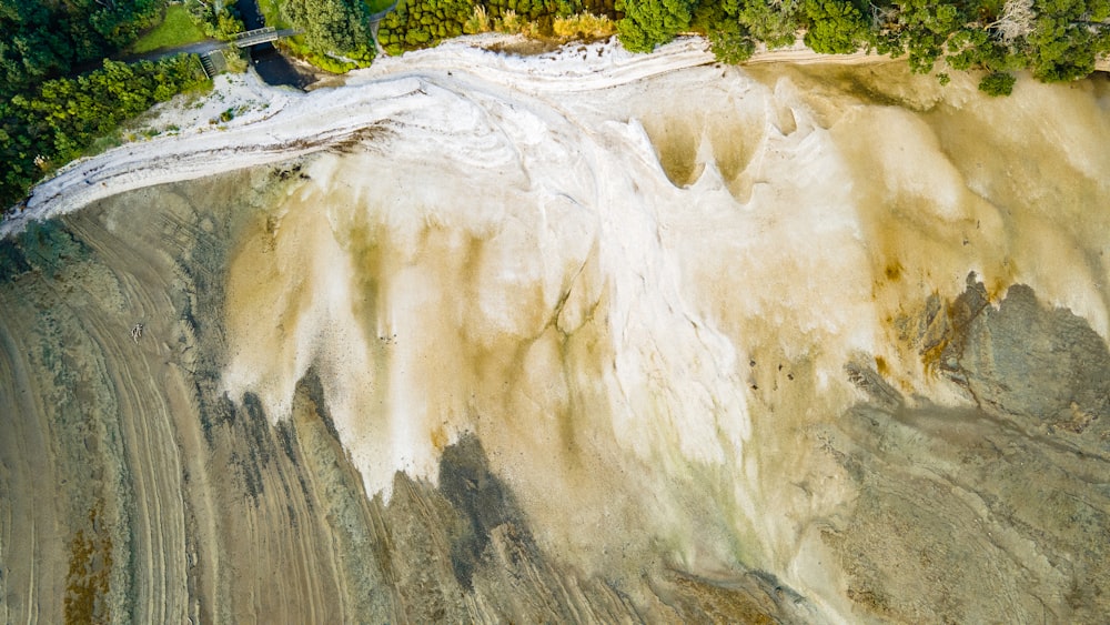 an aerial view of a mountain with a river running through it