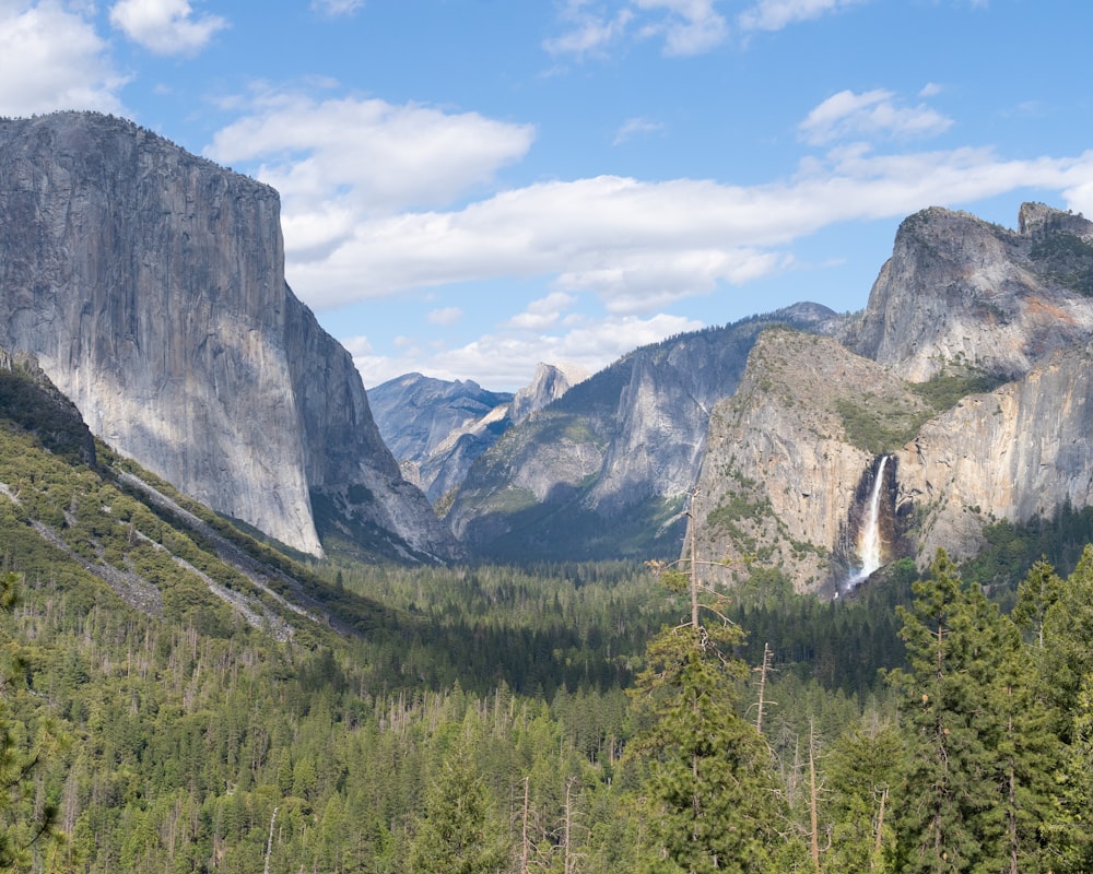 a view of a valley with mountains in the background