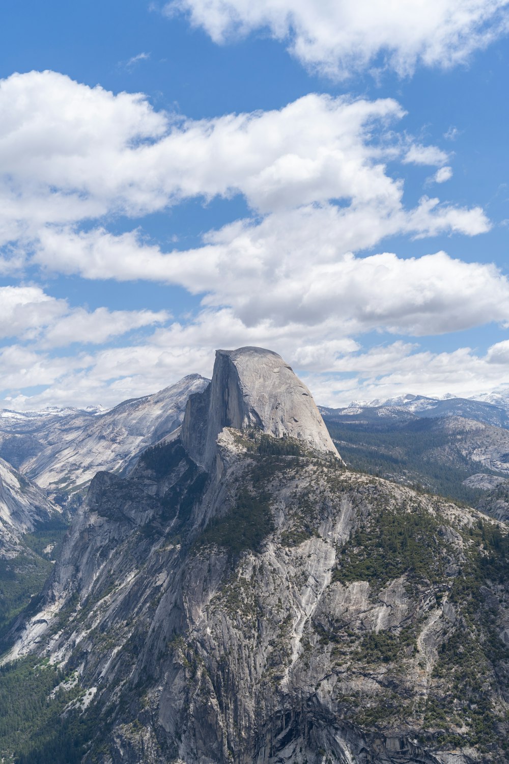 a view of the top of a mountain with a sky background