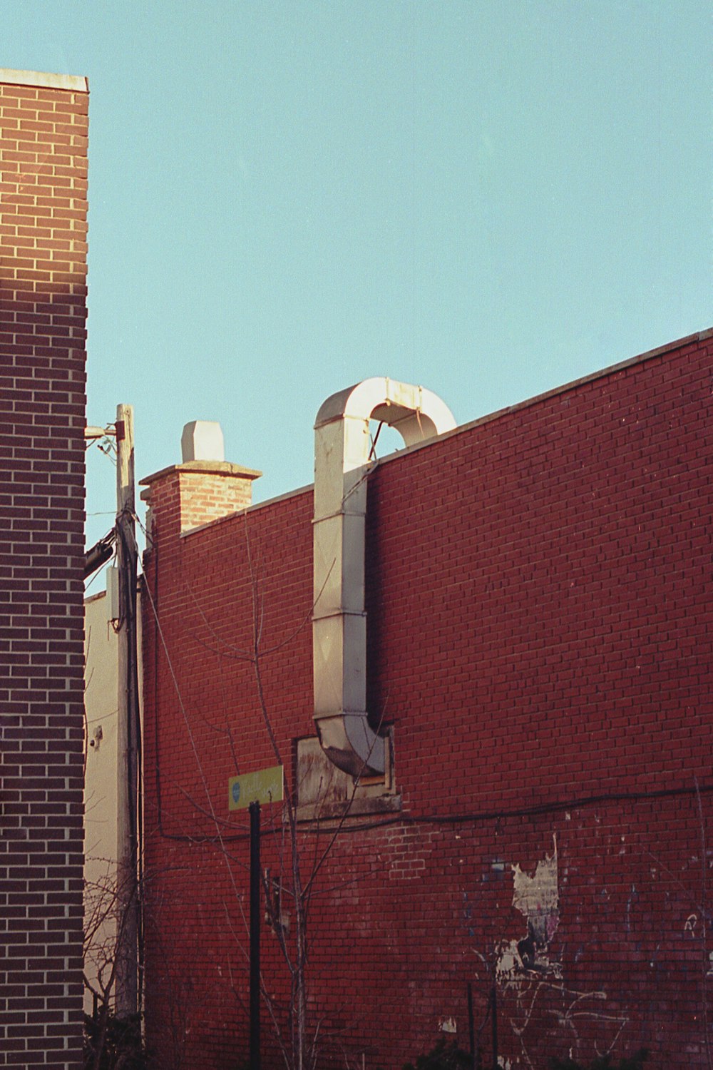 a brick building with a clock on the side of it