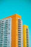 a couple of tall buildings sitting next to each other