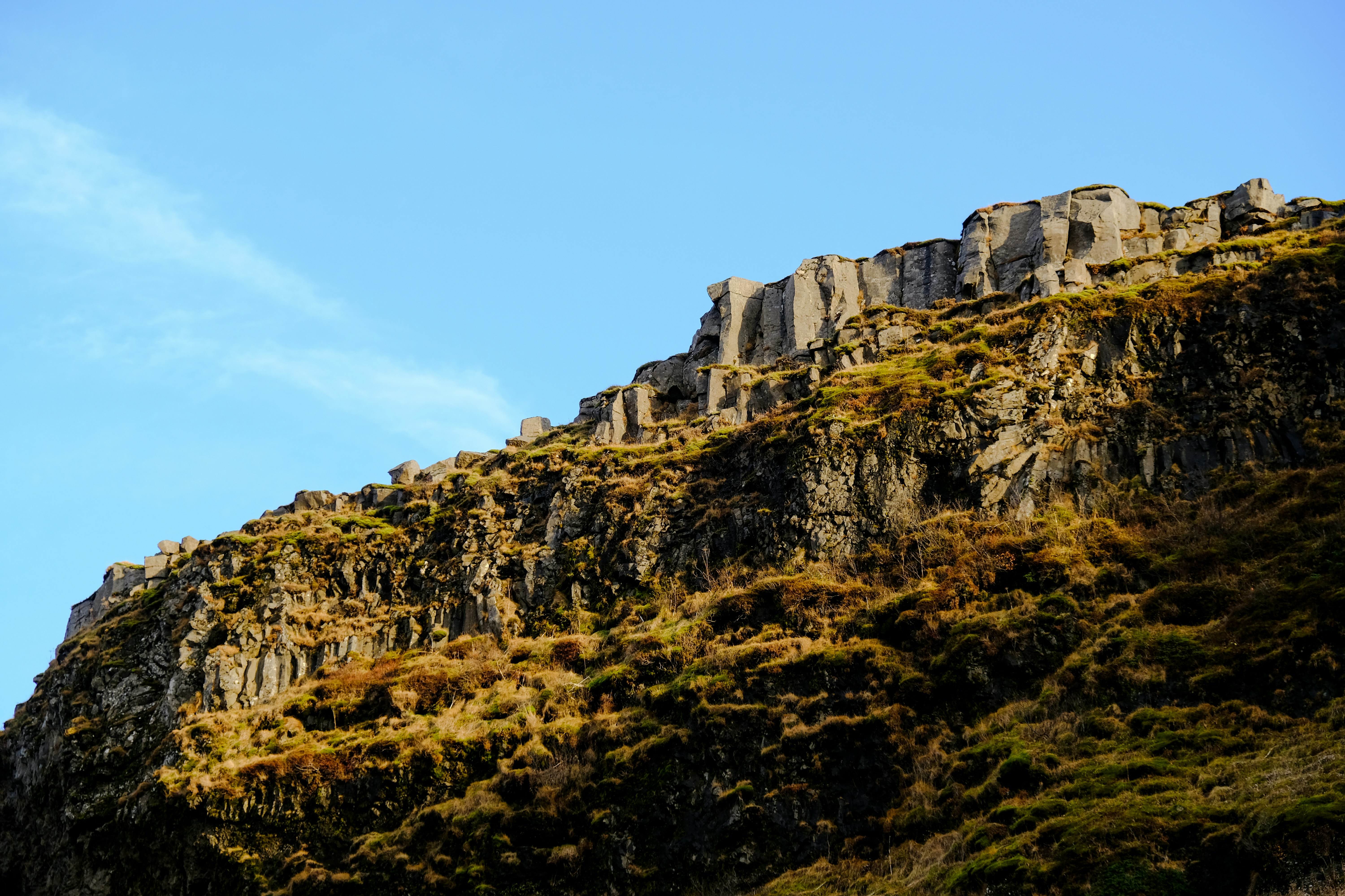 green and brown rocky mountain under blue sky during daytime, 
