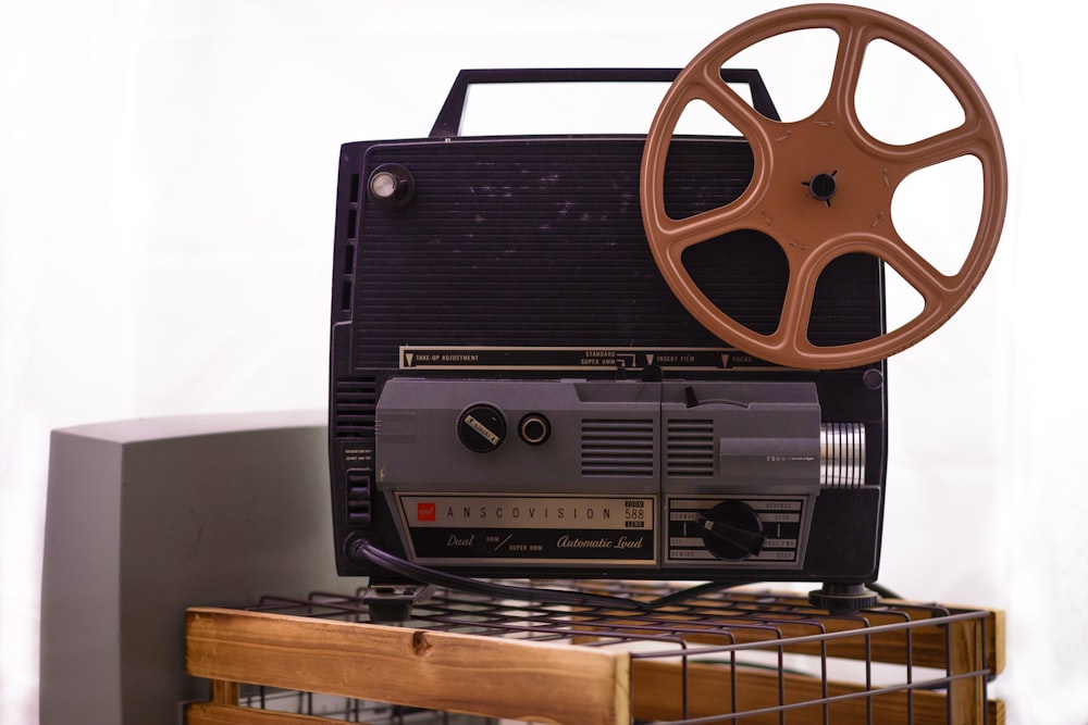 an old movie projector sitting on top of a table
