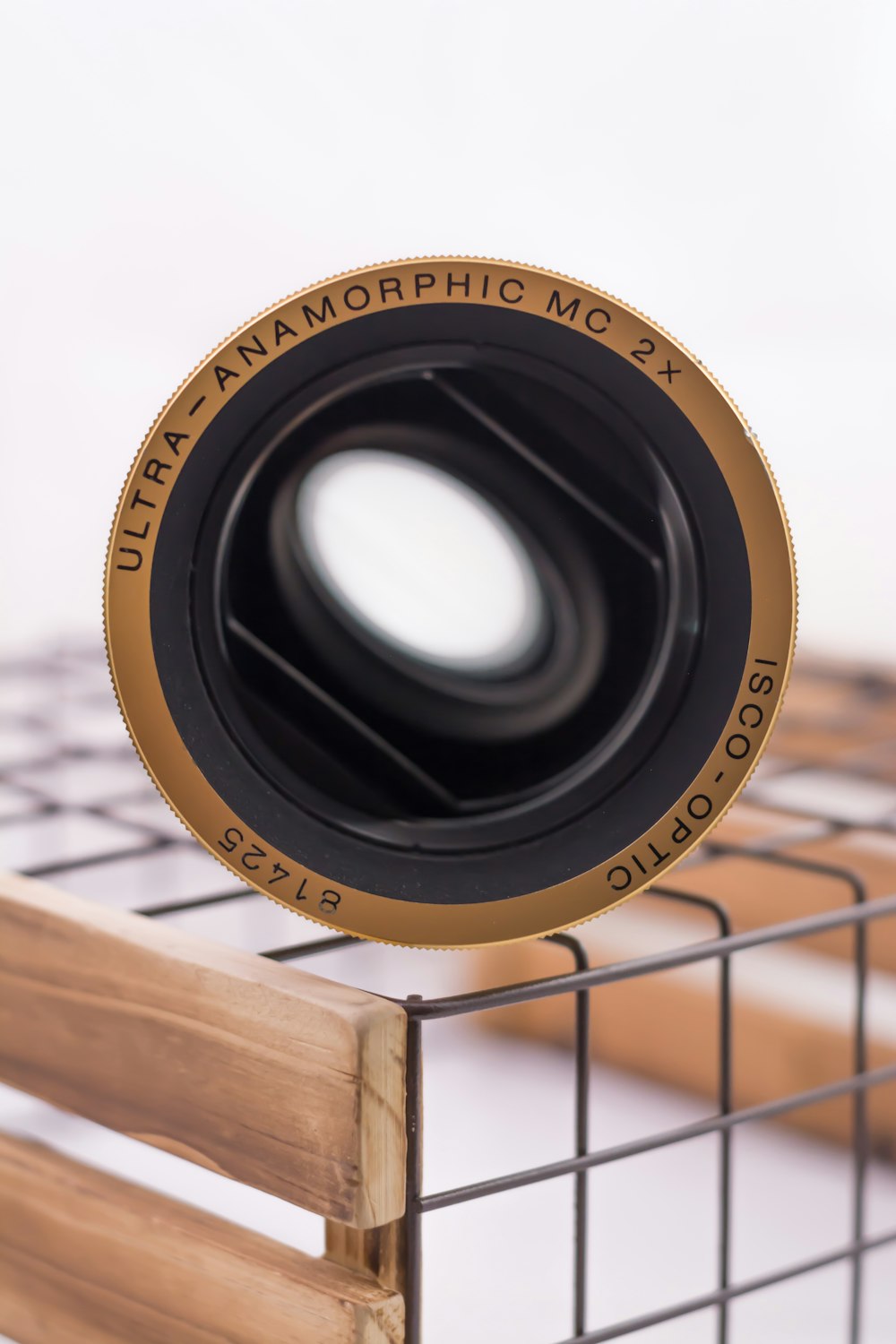 a camera lens sitting on top of a metal cage