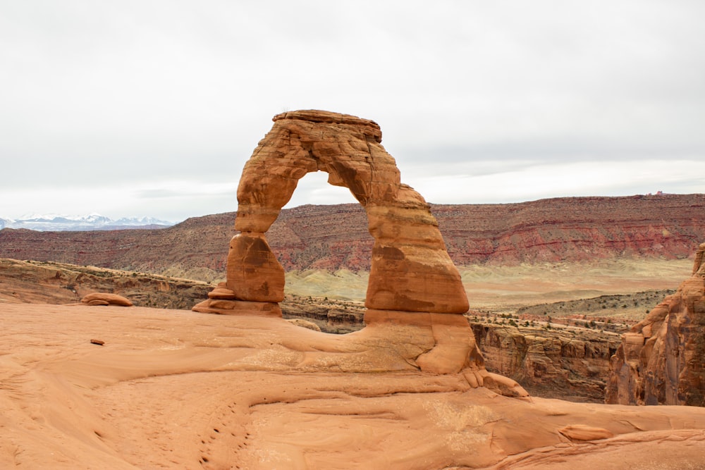 a large rock formation in the middle of a desert