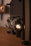 a close up of a radio on a wooden table