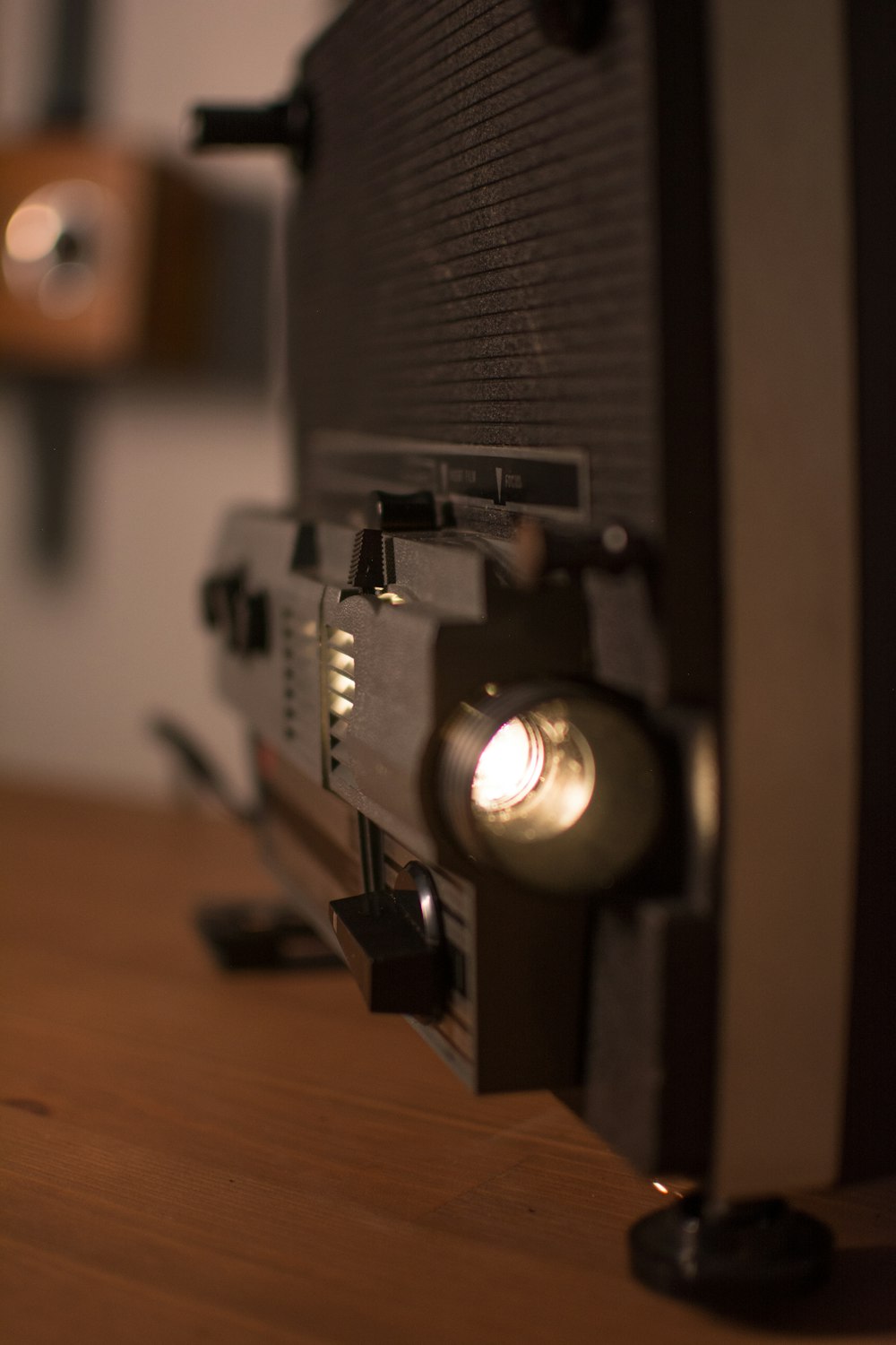 a close up of a radio on a wooden table