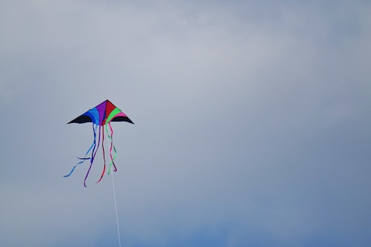 A colorful handcrafted kite with unique patterns.