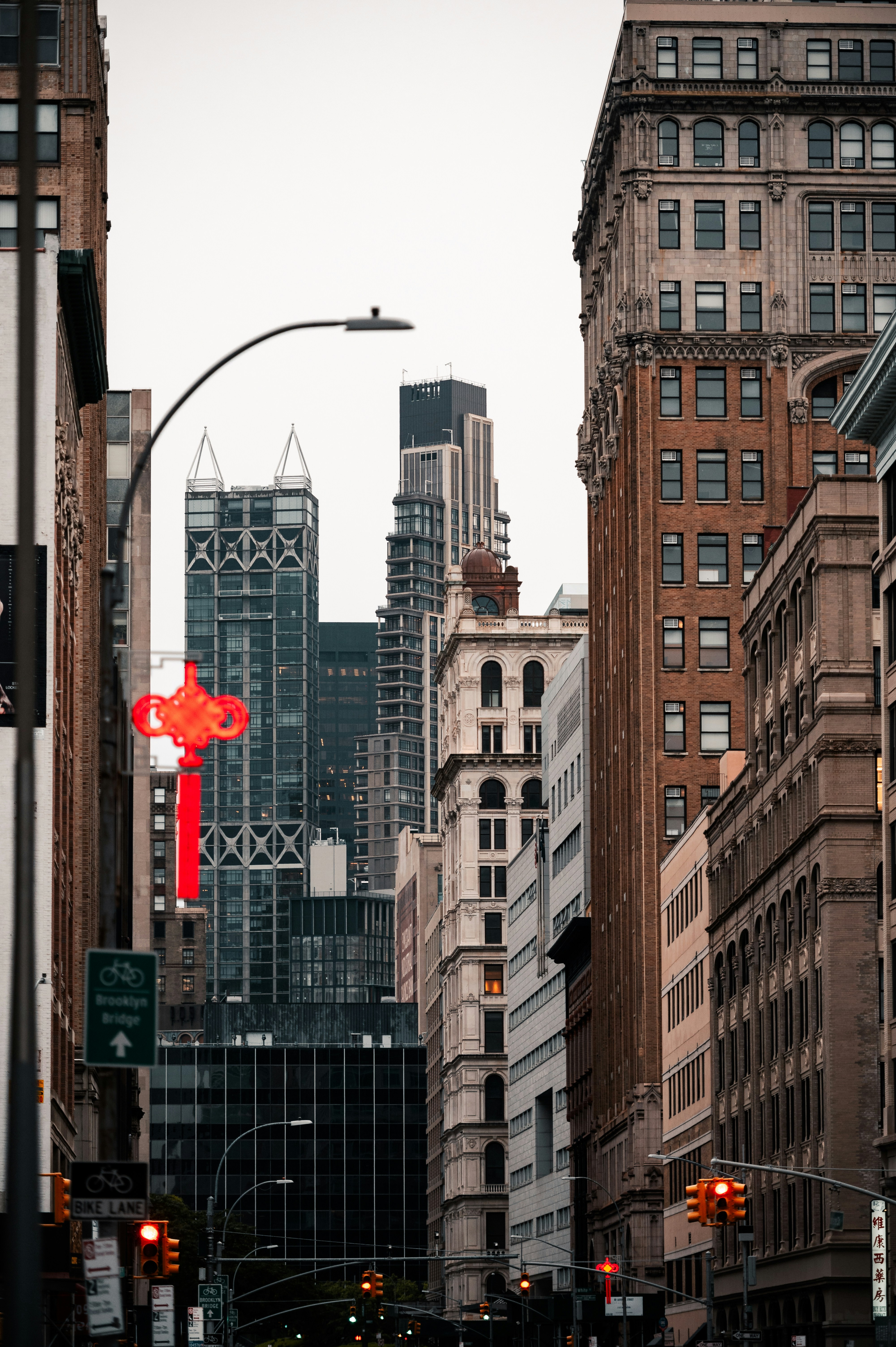 A city street filled with traffic surrounded by tall buildings photo ...