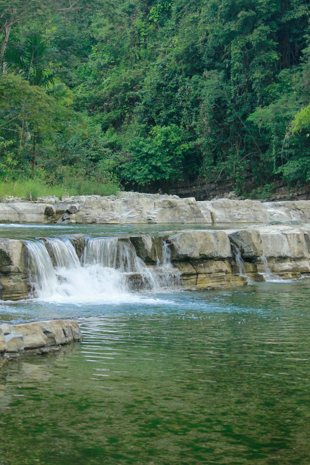 water falls on brown rock