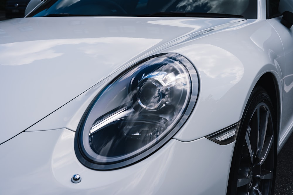 white car with black and silver wheel