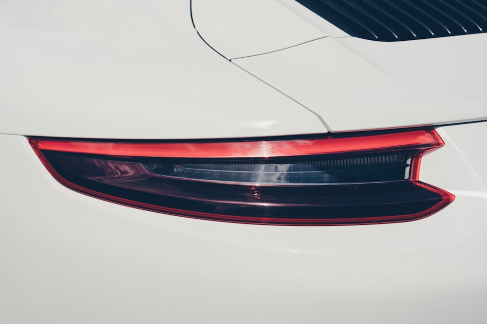 white car with red and black license plate