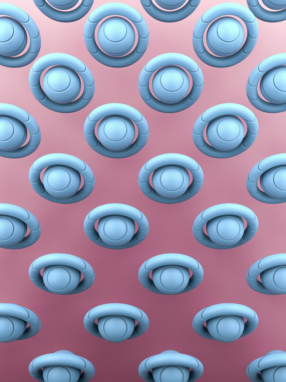 a bunch of blue objects that are on a pink surface