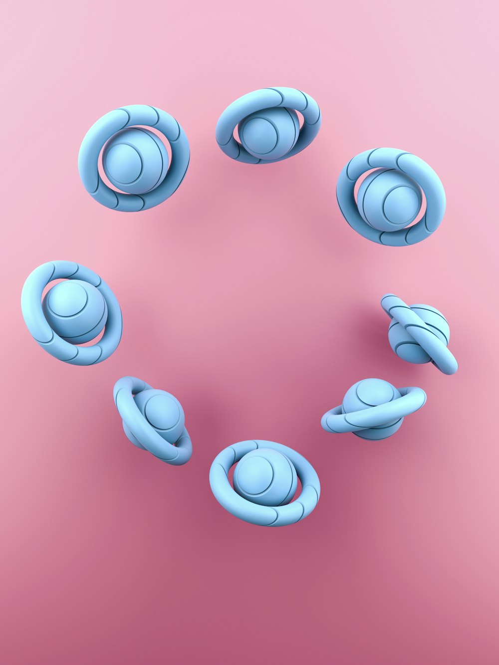 a group of blue objects on a pink background