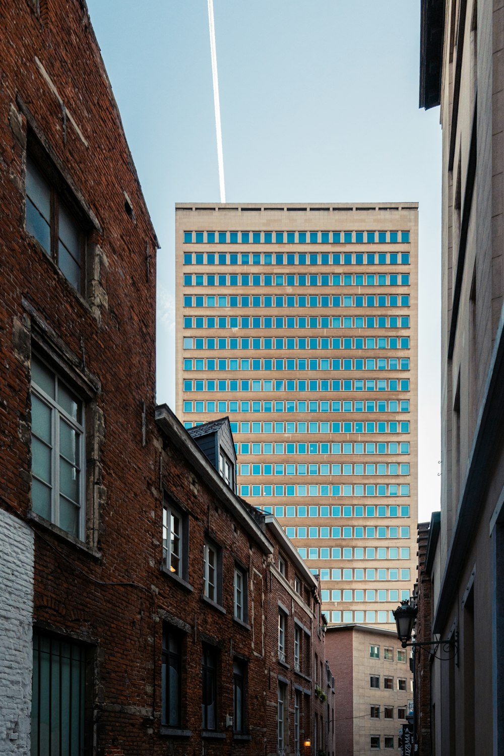 a very tall building towering over a city