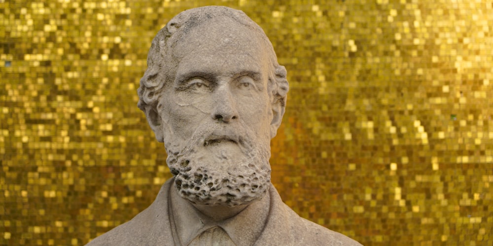 man in gray collared shirt statue